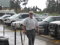 Grandpa Walking in Hellish Rain